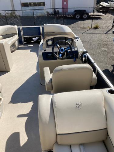 Slide: The Image of 2021 Cypress Cay C232 Tritoon interior with steering wheel and seating. - 8