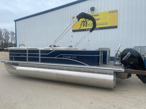 Slide: The Image of 2023 Cypress Cay Seabreeze 212 pontoon boat with Mercury outboard motor. - 1