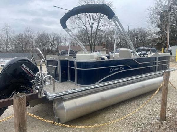 Slide: The Image of 2023 Cypress Cay Seabreeze 212 pontoon boat with Mercury outboard motor. - 2