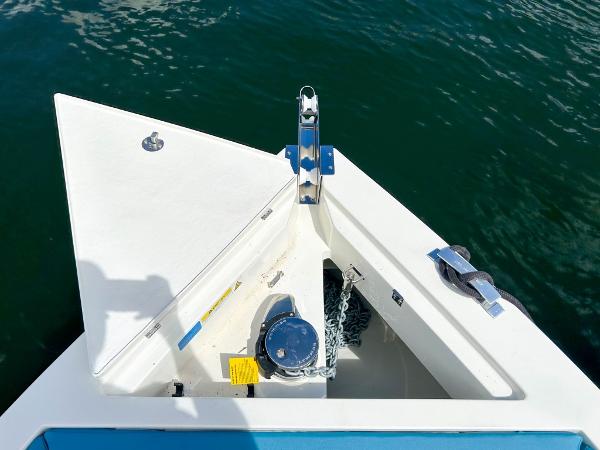 Slide: The Image of De Antonio Yachts D28 Open 2023 bow with anchor, on calm water. - 20