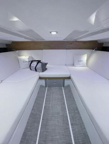 Slide: The Image of Interior of 2024 De Antonio Yachts D36 OPEN, featuring sleek white seating and modern design. - 11