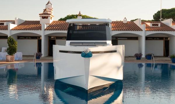 Slide: The Image of 2024 De Antonio Yachts D36 OPEN in a serene marina setting. - 4