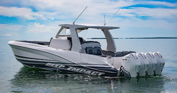 Slide: The Image of 2024 Deep Impact 369 boat with quad outboard engines on calm water. - 0