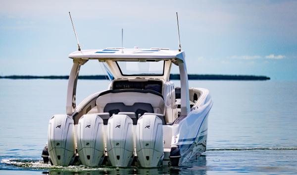 Slide: The Image of 2024 Deep Impact 369 Deep Impact boat with quad outboard engines on calm water. - 10
