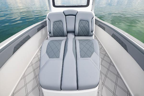 Slide: The Image of 2024 Deep Impact 369 boat interior with luxurious seating and diamond-stitched upholstery. - 26