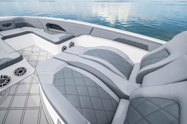 Slide: The Image of Luxurious seating on the 2024 Deep Impact 369 Deep Impact boat, with diamond-stitched upholstery. - 29