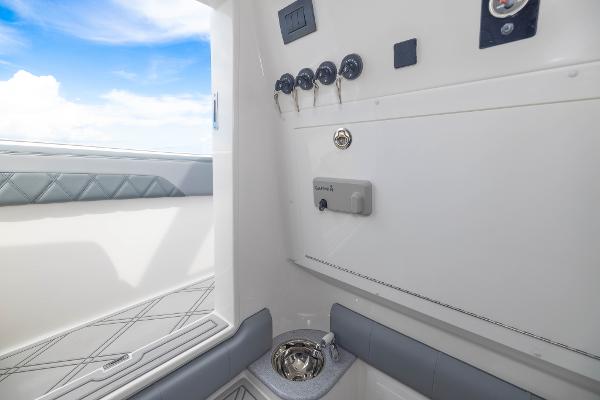 Slide: The Image of 2024 Deep Impact 369 boat interior with control panel and seating. - 49