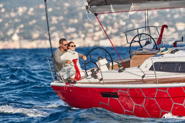 Slide: The Image of 2025 Dehler 38 SQ sailing on open water with two people on deck - 2
