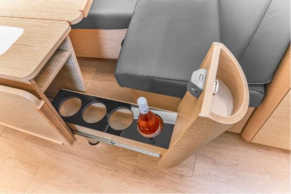 Slide: The Image of Built-in bottle storage in the 2025 Dehler 38 SQ yacht interior. - 20