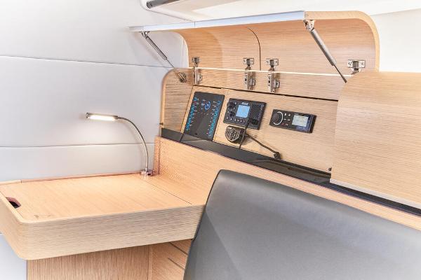 Slide: The Image of Navigation station of the 2025 Dehler 38 SQ yacht with modern control panels. - 22