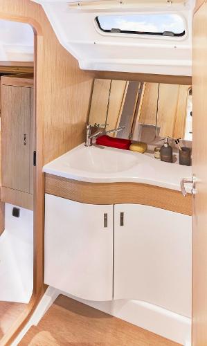 Slide: The Image of Modern bathroom interior of 2025 Dehler 38 SQ yacht with wooden accents. - 25