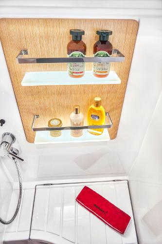 Slide: The Image of Dehler 38 SQ 2025 yacht bathroom with toiletries and red towel. - 26