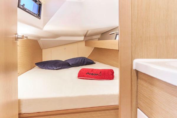 Slide: The Image of Cozy cabin interior of 2025 Dehler 38 SQ yacht with bed and porthole. - 27