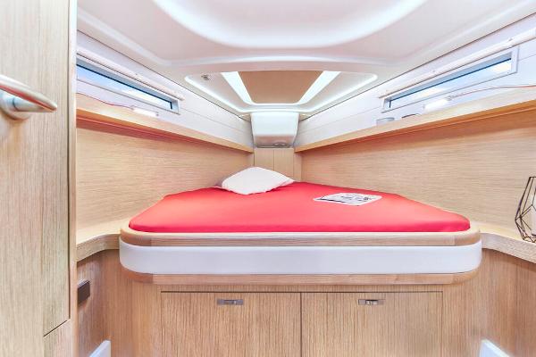 Slide: The Image of Interior cabin of 2025 Dehler 38 SQ yacht with red bedding. - 29