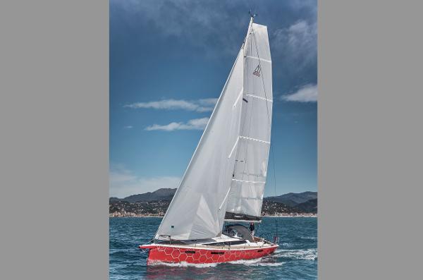 Slide: The Image of 2025 Dehler 38 SQ sailboat with red hull sailing on open water. - 31