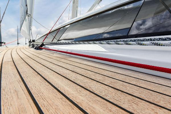 Slide: The Image of Close-up of the teak deck on a 2025 Dehler 38 SQ sailboat. - 6