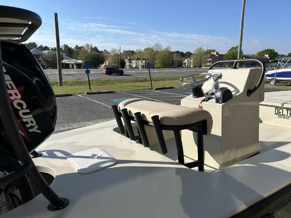 Slide: The Image of 2024 Delta Boatworks Delta 18 with Mercury engine in a parking lot. - 12