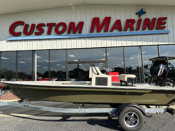 Slide: The Image of 2024 Delta Boatworks Delta 18 on trailer at Custom Marine dealership. - 2