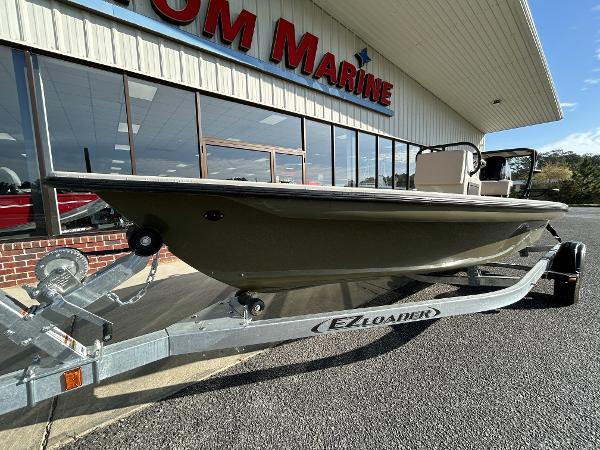 Slide: The Image of 2024 Delta Boatworks Delta 18 on EZ Loader trailer outside showroom. - 3