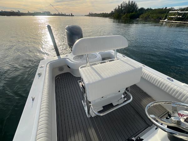 Slide: The Image of 2024 Deno 2400 CC boat on calm water at sunset. - 9