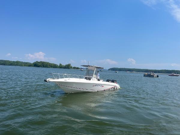 Slide: The Image of 1999 Donzi 30 ZF boat on a lake with clear blue sky. - 2