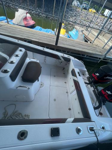 Slide: The Image of 1999 Donzi 30 ZF boat docked, showing interior seating and deck layout. - 35