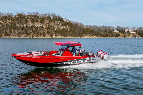 Slide: The Image of 2024 Donzi 39 VRZ speedboat cruising on a lake. - 10
