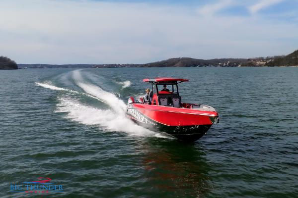 Slide: The Image of 2024 Donzi 39 VRZ speedboat cruising on a lake. - 13