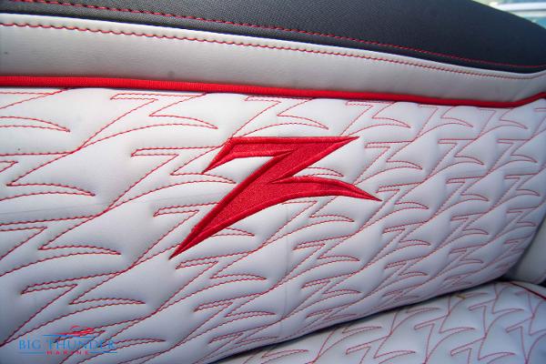 Slide: The Image of 2024 Donzi 39 VRZ boat seat with red stitching and logo. - 43
