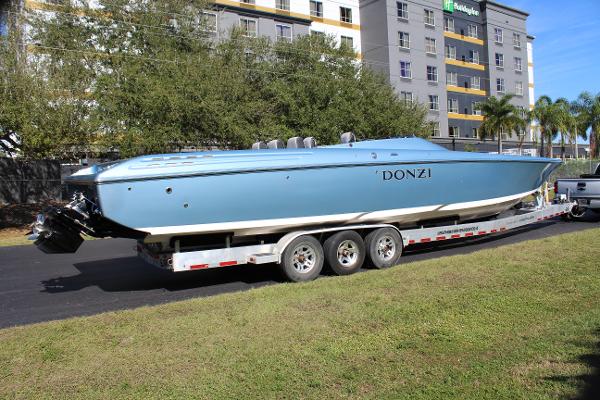 Slide: The Image of 2006 Donzi 43 ZR powerboat on a trailer in a parking lot. - 12