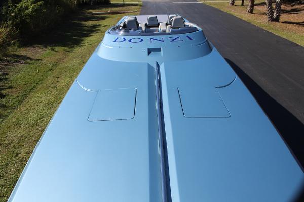 Slide: The Image of 2006 Donzi 43 ZR speedboat in blue, top view on a driveway. - 16