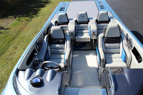 Slide: The Image of 2006 Donzi 43 ZR boat interior with seating and steering wheel. - 18
