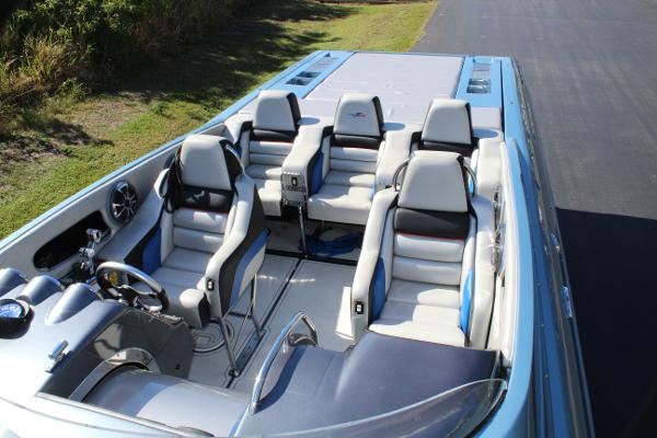 Slide: The Image of 2006 Donzi 43 ZR speedboat interior with four seats and sleek design. - 20