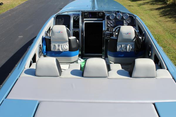 Slide: The Image of 2006 Donzi 43 ZR boat interior with seating and dashboard. - 23