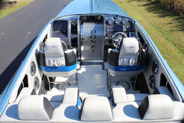 Slide: The Image of 2006 Donzi 43 ZR speedboat interior with dual helm seats and modern dashboard. - 24