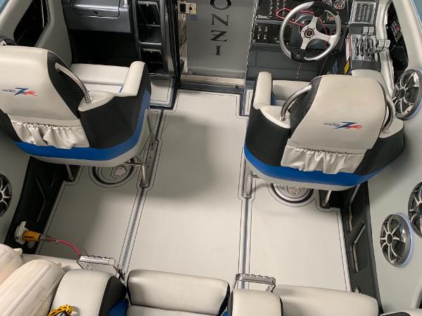 Slide: The Image of Interior of a 2006 Donzi 43 ZR speedboat with white and blue seating. - 25