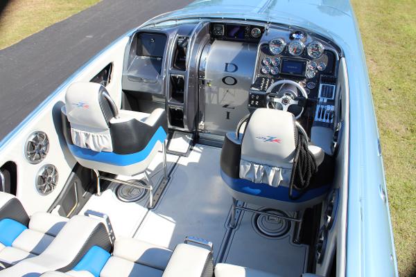 Slide: The Image of 2006 Donzi 43 ZR boat interior with modern dashboard and seating. - 26
