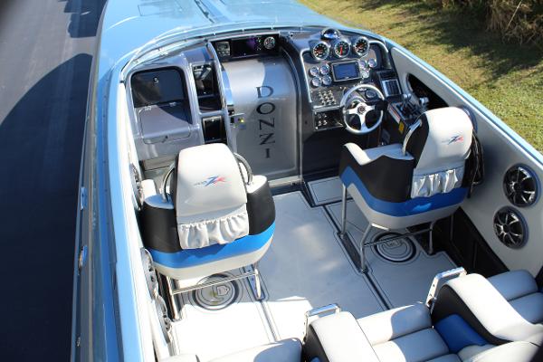 Slide: The Image of 2006 Donzi 43 ZR boat interior with dual seats and advanced dashboard. - 27
