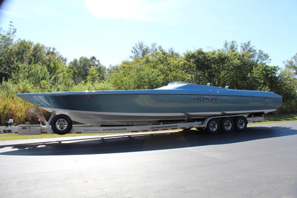 Slide: The Image of 2006 Donzi 43 ZR speedboat on a trailer, parked outdoors. - 3