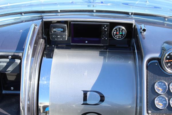 Slide: The Image of 2006 Donzi 43 ZR dashboard with navigation and control instruments. - 30