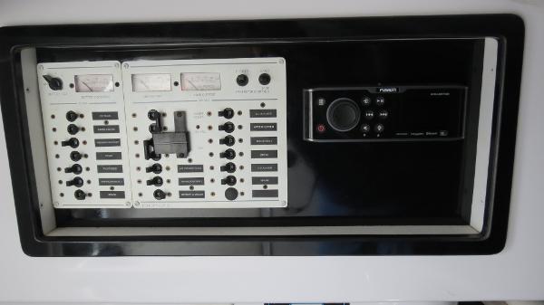 Slide: The Image of Control panel of a 2006 Donzi 43 ZR boat with switches and gauges. - 34