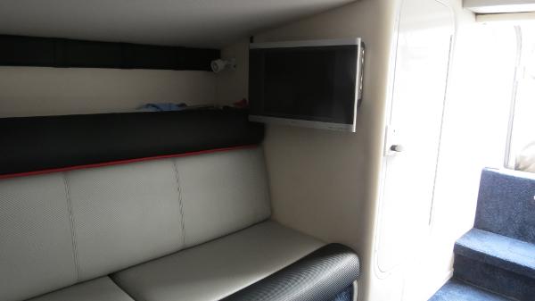 Slide: The Image of Interior of 2006 Donzi 43 ZR boat with sofa and wall-mounted TV. - 35