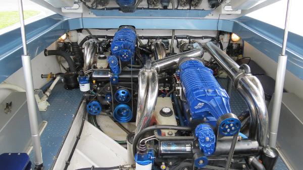 Slide: The Image of 2006 Donzi 43 ZR engine compartment with twin blue supercharged engines. - 37