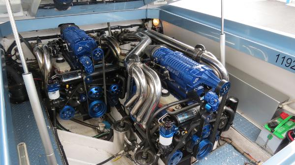Slide: The Image of 2006 Donzi 43 ZR boat engine compartment with twin blue engines. - 39