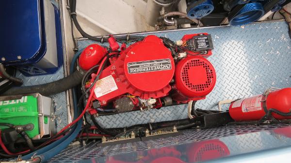 Slide: The Image of 2006 Donzi 43 ZR engine compartment with Westerbeke generator and fire extinguisher. - 40