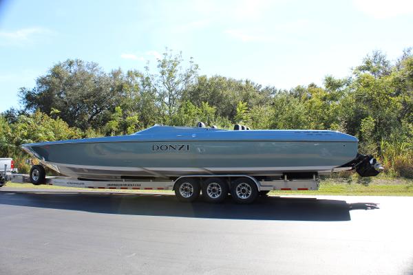 Slide: The Image of 2006 Donzi 43 ZR speedboat on a trailer, parked on a sunny day. - 5