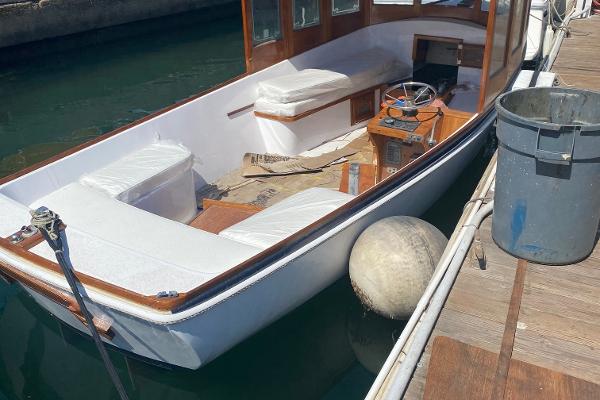 Slide: The Image of 1984 Duffy 20 Hardtop Diesel boat docked, interior view with steering wheel and seating. - 5