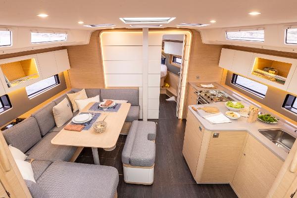 Slide: The Image of Modern interior of 2024 Dufour 41 yacht with kitchen and dining area. - 12