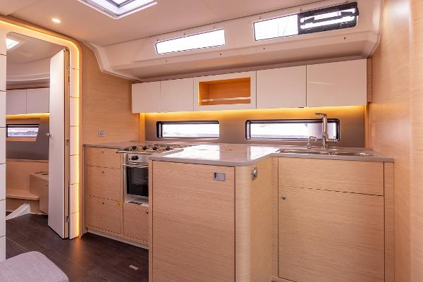 Slide: The Image of Modern kitchen interior of 2024 Dufour 41 yacht with sleek cabinetry and ample lighting. - 16
