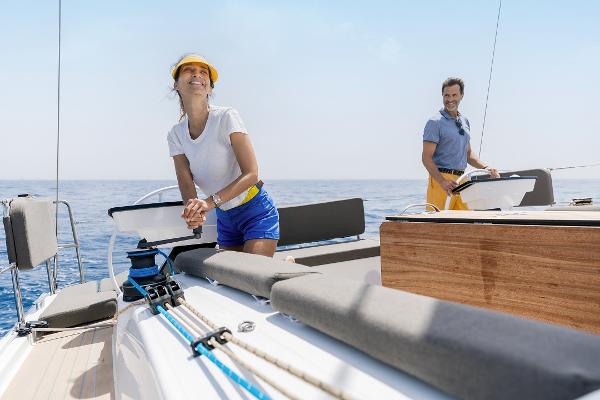 Slide: The Image of Couple sailing on a 2024 Dufour 41 yacht in open waters. - 4